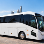Dubai chauffeur service and rental buses near me — Go Bus driver standing beside vehicle