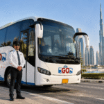 Dubai chauffeur service — Go Bus driver standing beside vehicle